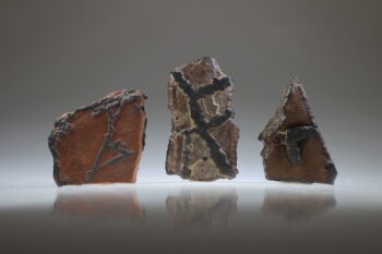 Liesegang Shapes of Carpet Rock